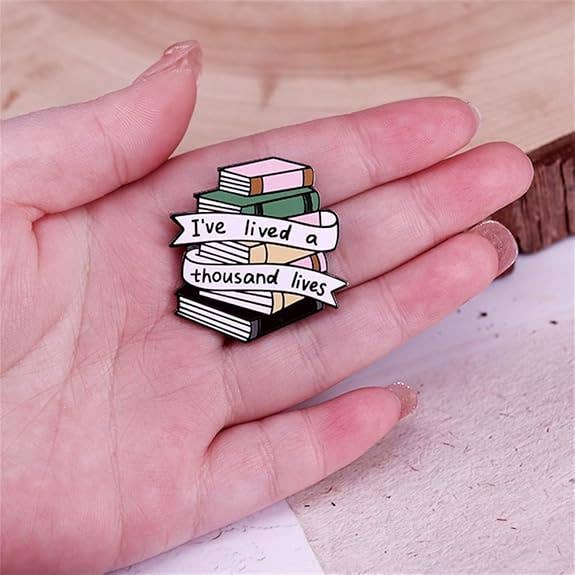 I've Lived a Thousand Lives Book Stack Enamel Pin